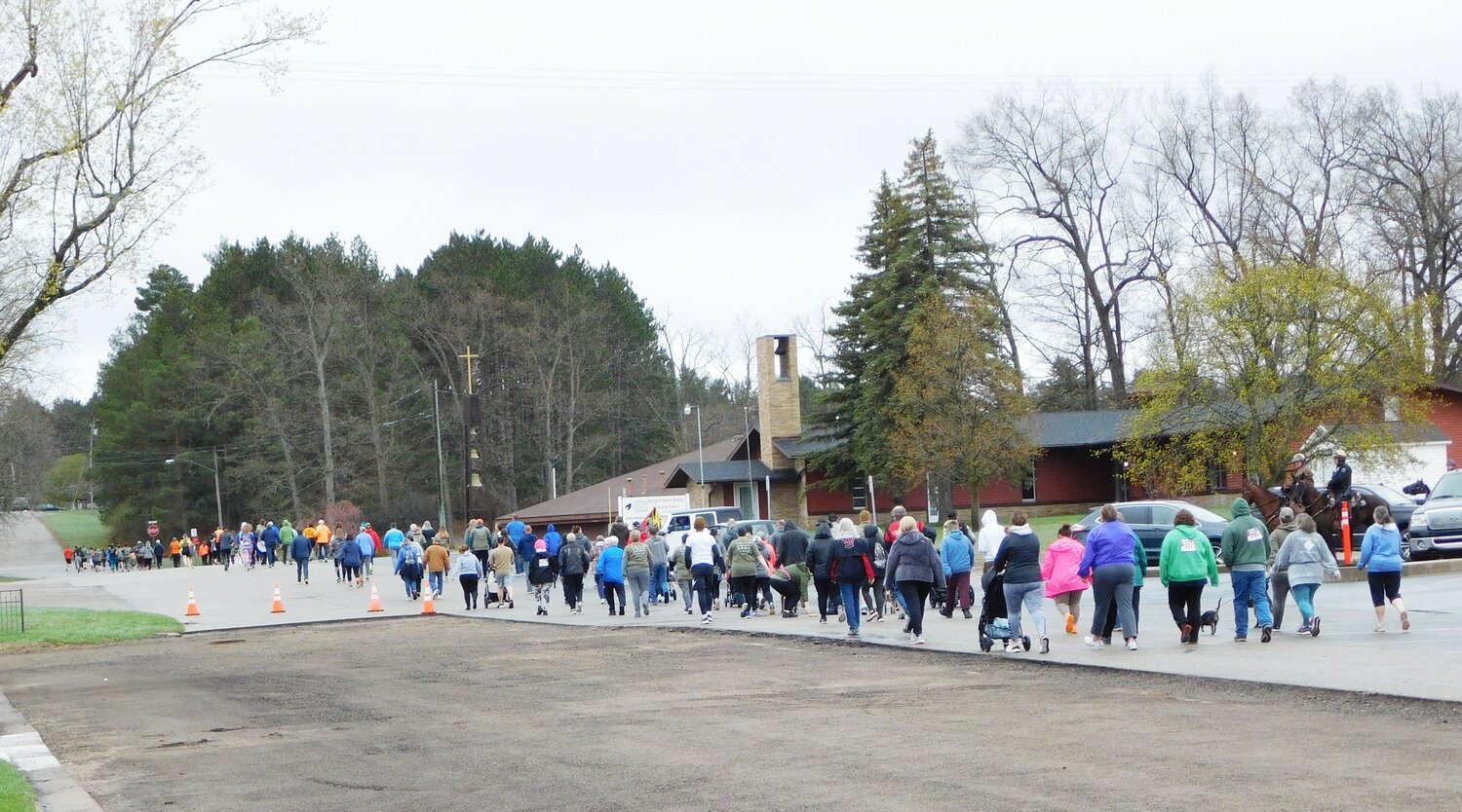 A sea of walkers strikes out on the 3.1-mile course, cheerful and committed to the task.